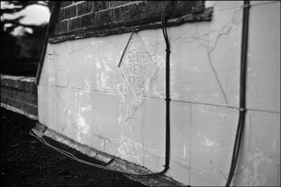 034 Stucco dated 1732 on roof of house © David Hanks